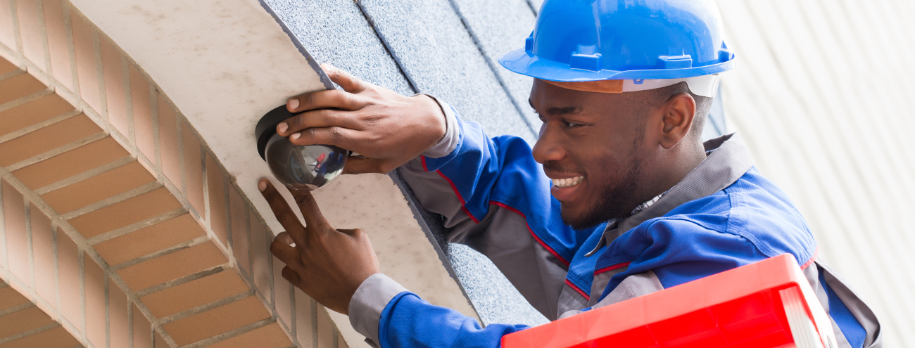 Technician Installing a CCTV Camera